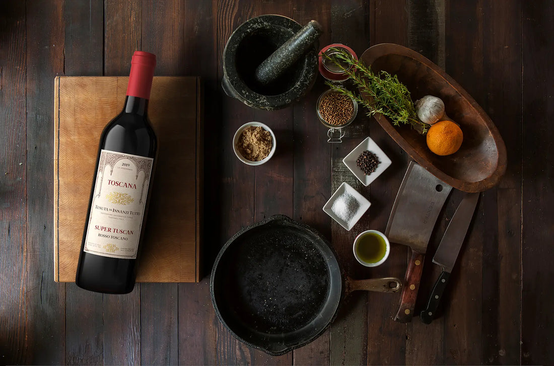 Red wine and cooking ingredients on a wooden surface