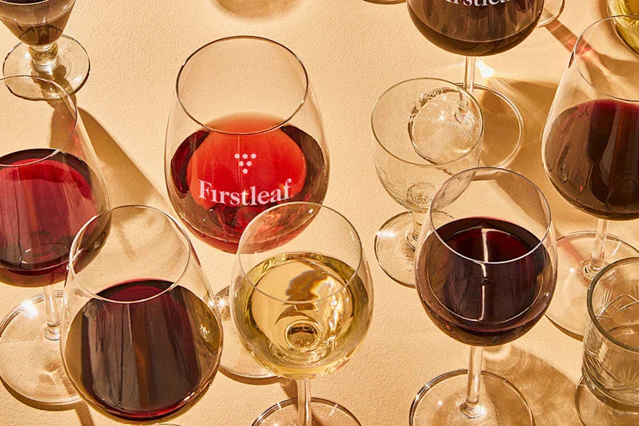 Glasses of red and white Firstleaf wine.