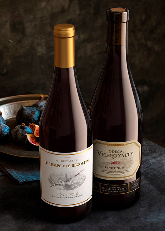 Two bottles of Firstleaf Fine Wine on a dark background with a bowl of figs.