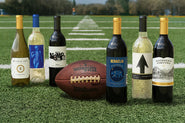 Wine bottles and a football on a football field