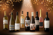 9 bottles of wine red white and sparkling rose with gold confetti falling down